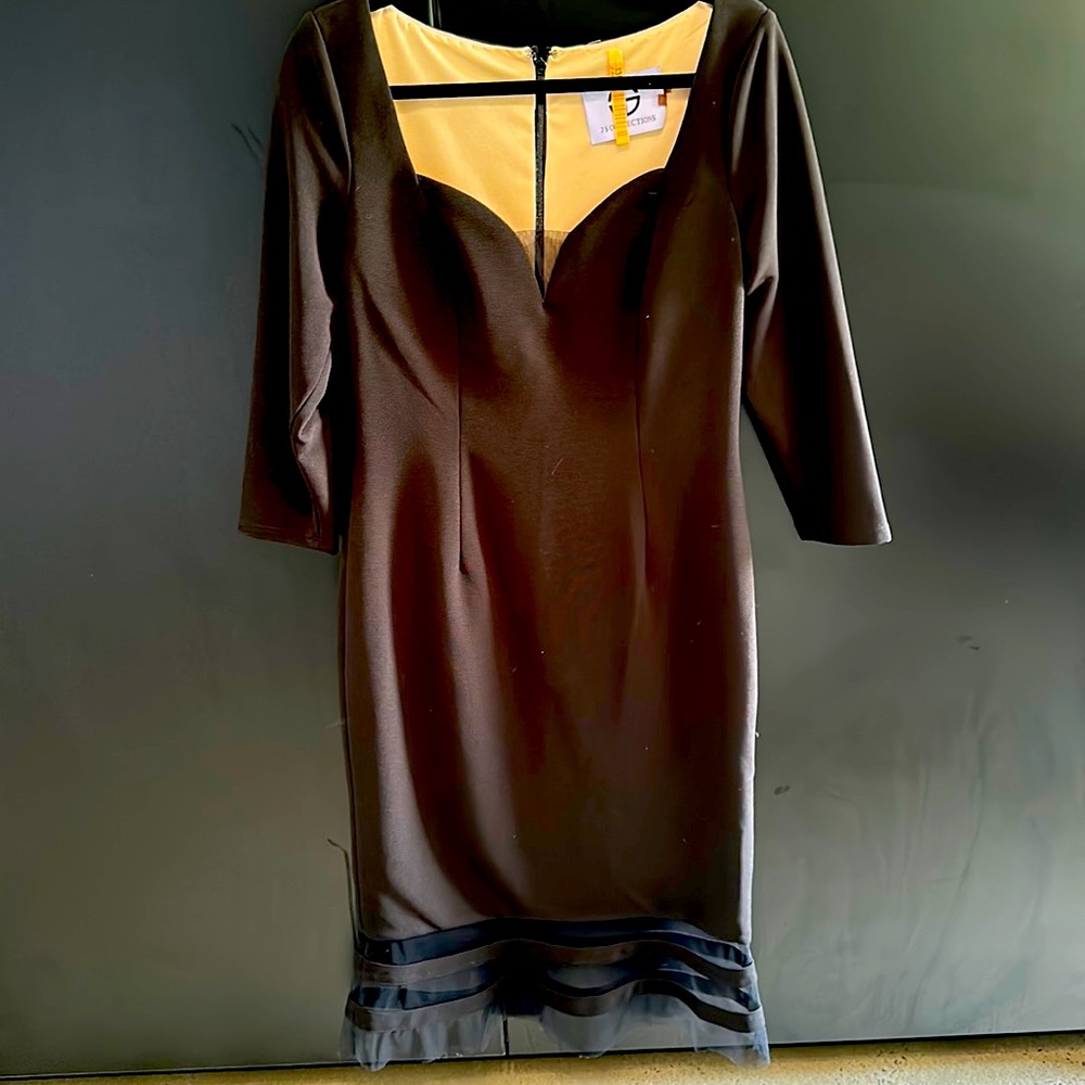 Selling due to losing weight. 3/4 sleeve cocktail dress with mesh detail.